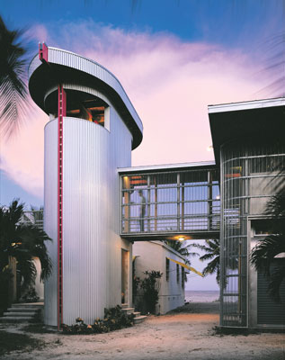 
Standing as sentinel against the evening sky, the corrugated steel stairwell tower connects the home's wings with a breezeway bridge.
